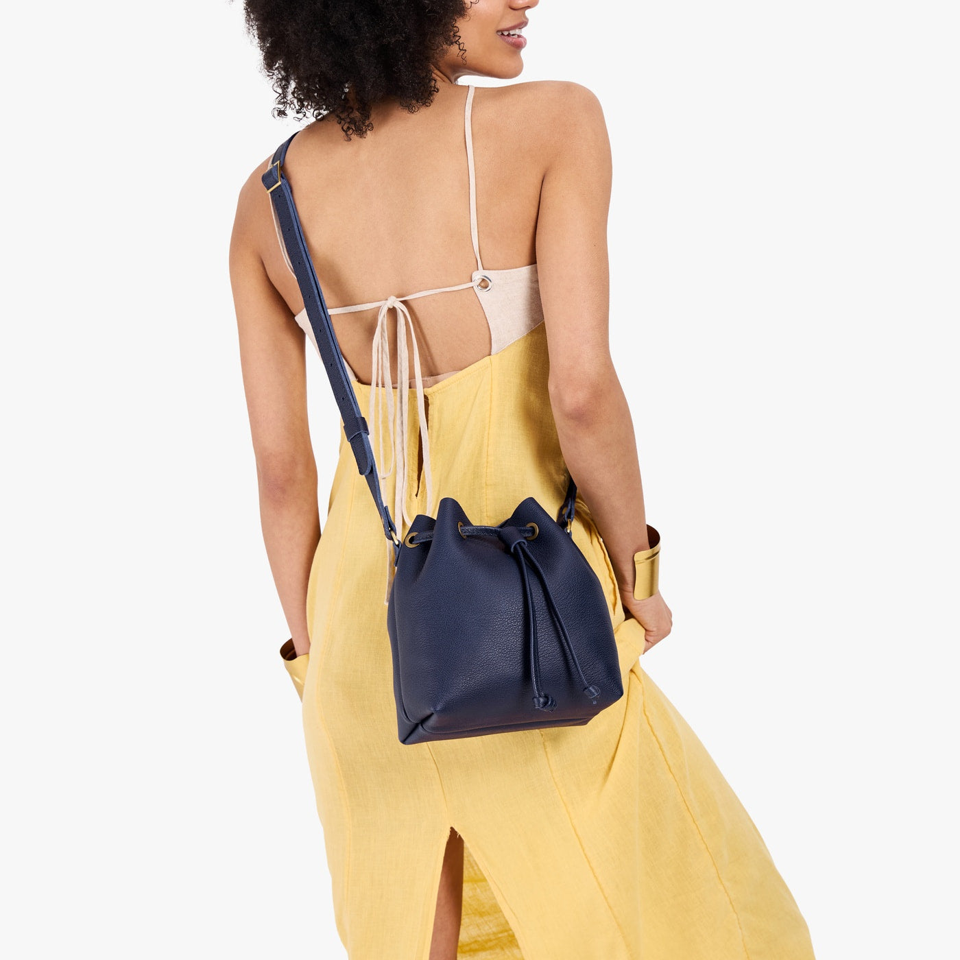 Cobalt*Small | Model wearing slouchy crossbody bag with drawstring closure
