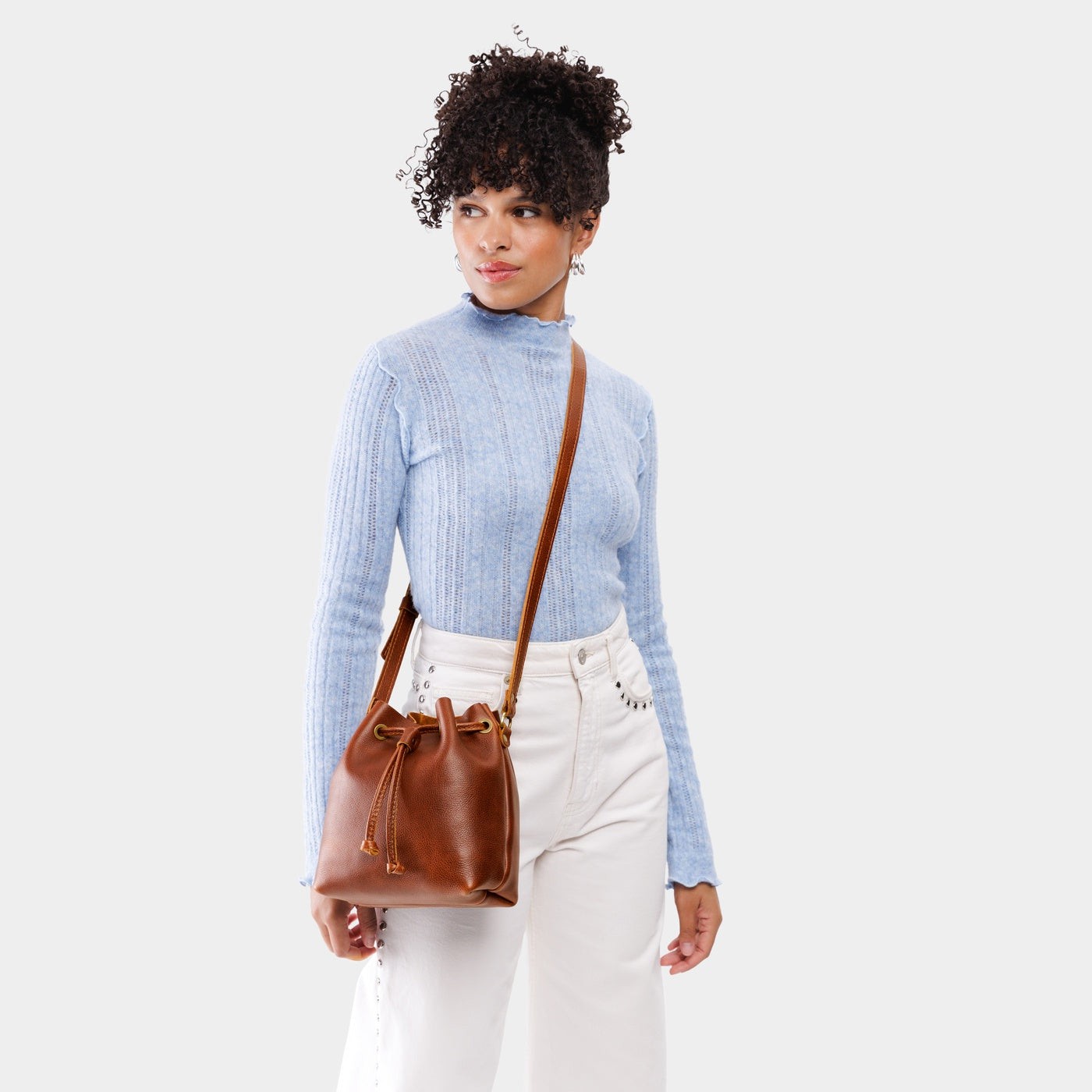 Nutmeg*Small | Model wearing slouchy crossbody bag with drawstring closure