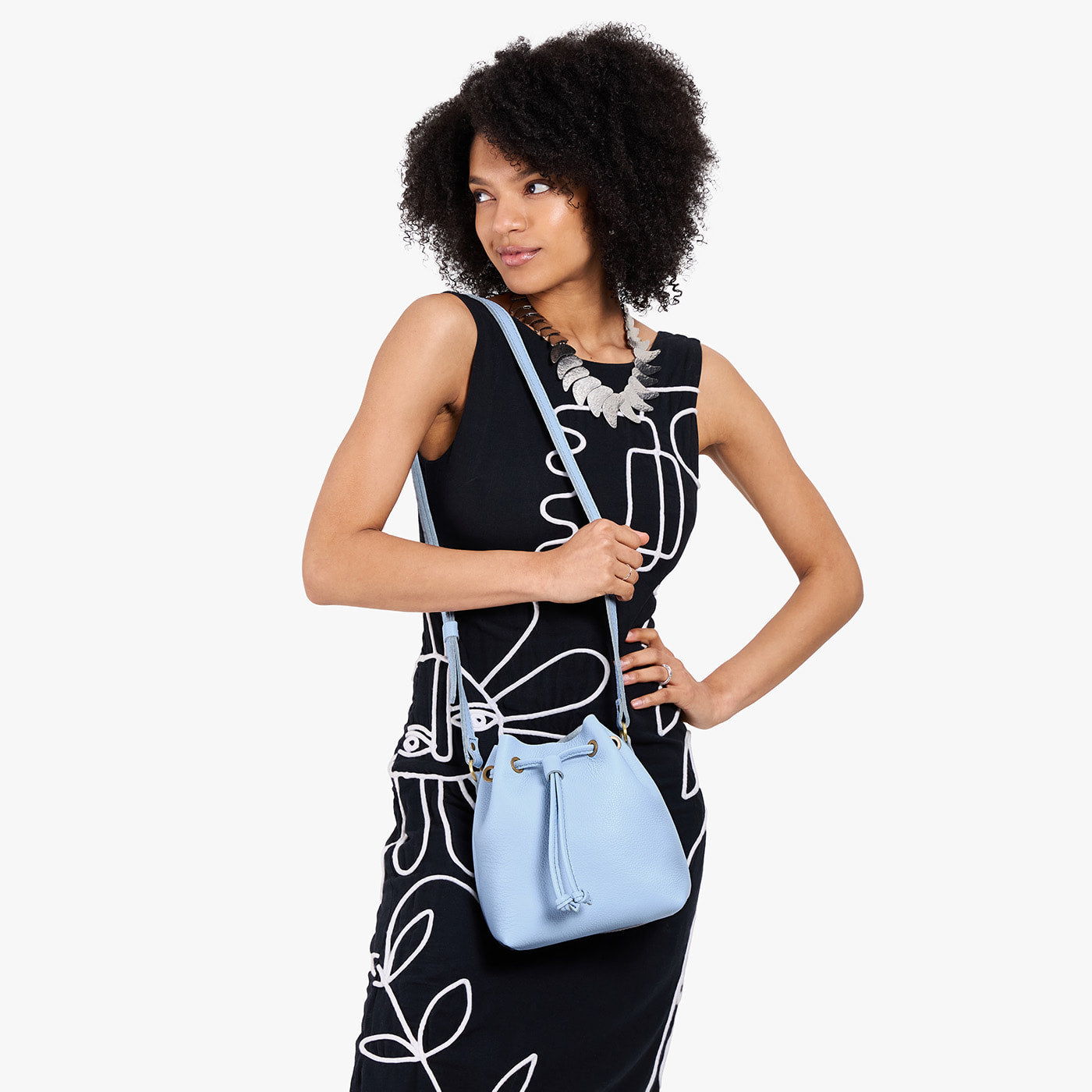 Skyway*Small | Model wearing slouchy crossbody bag with drawstring closure