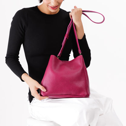 Cosmo | symmetrical bucket bag with latch closure and removable crossbody strap