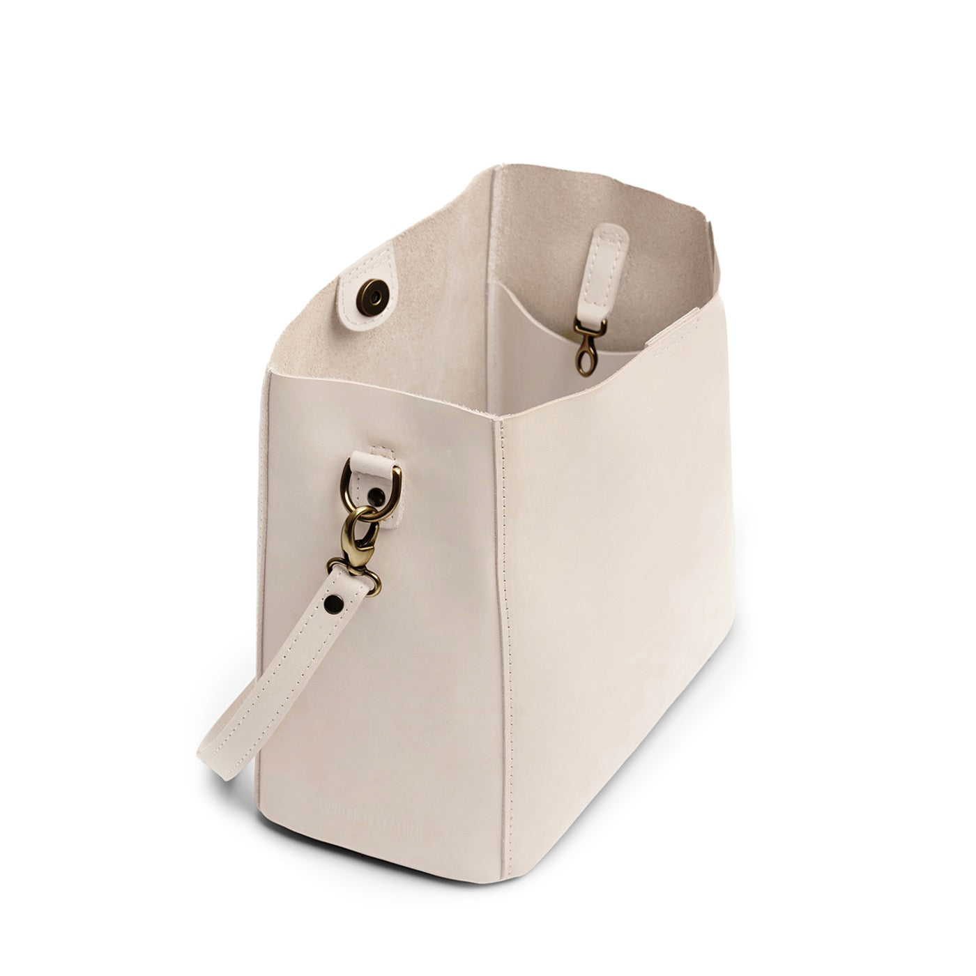 Dragon Bone | symmetrical bucket bag with latch closure and removable crossbody strap