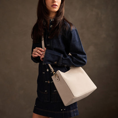 Dragon Bone | symmetrical bucket bag with latch closure and removable crossbody strap