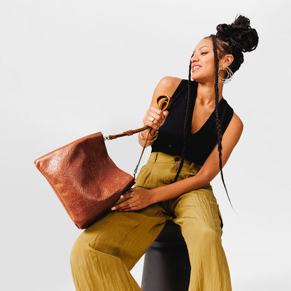 Meadow | symmetrical bucket bag with latch closure and removable crossbody strap