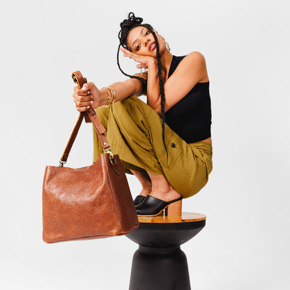 Meadow | symmetrical bucket bag with latch closure and removable crossbody strap