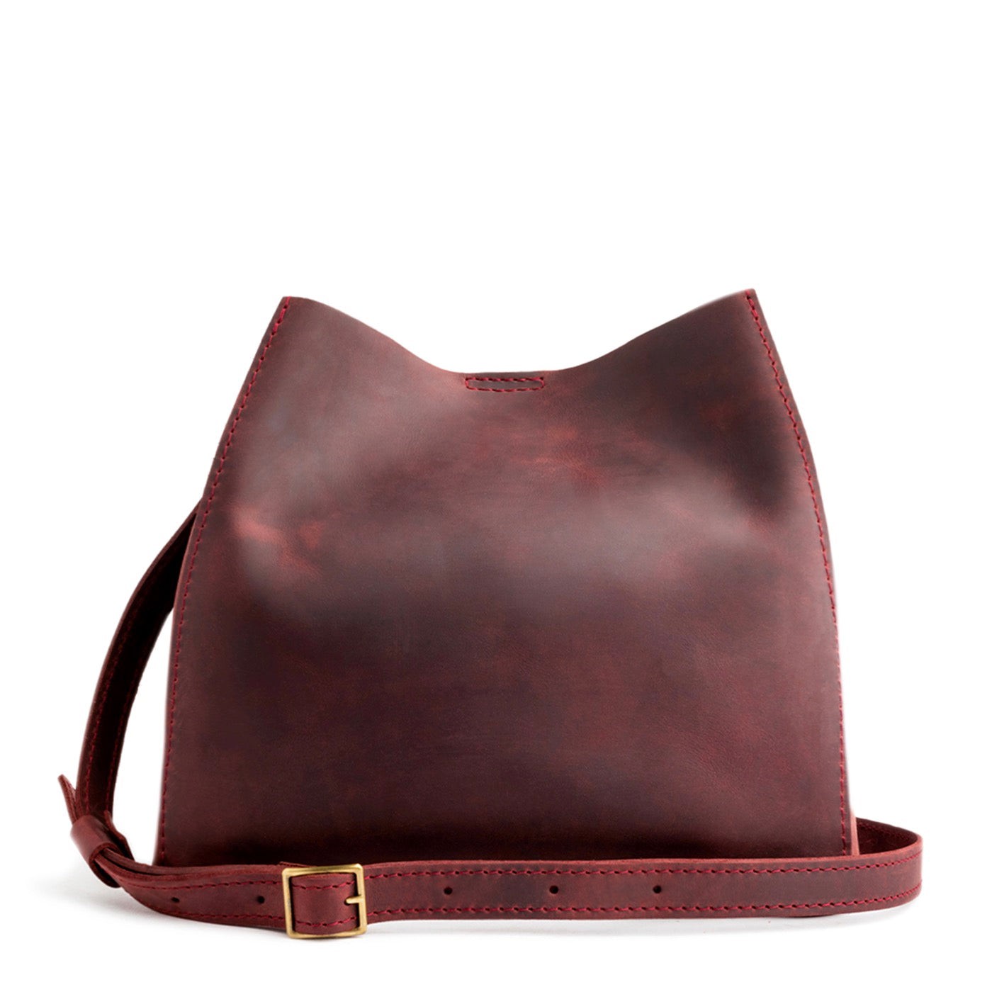 Merlot | symmetrical bucket bag with latch closure and removable crossbody strap