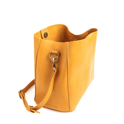 Sunflower | symmetrical bucket bag with latch closure and removable crossbody strap