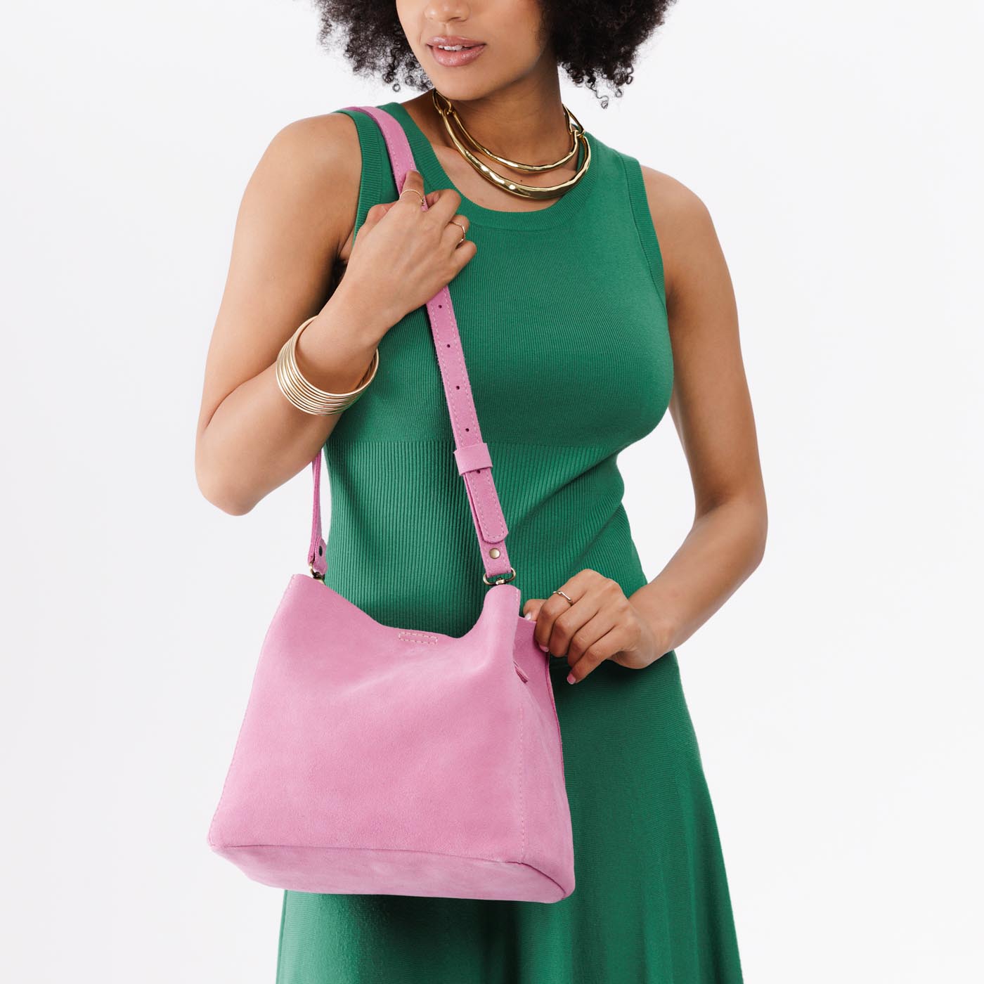 Pink Suede | symmetrical bucket bag with latch closure and removable crossbody strap