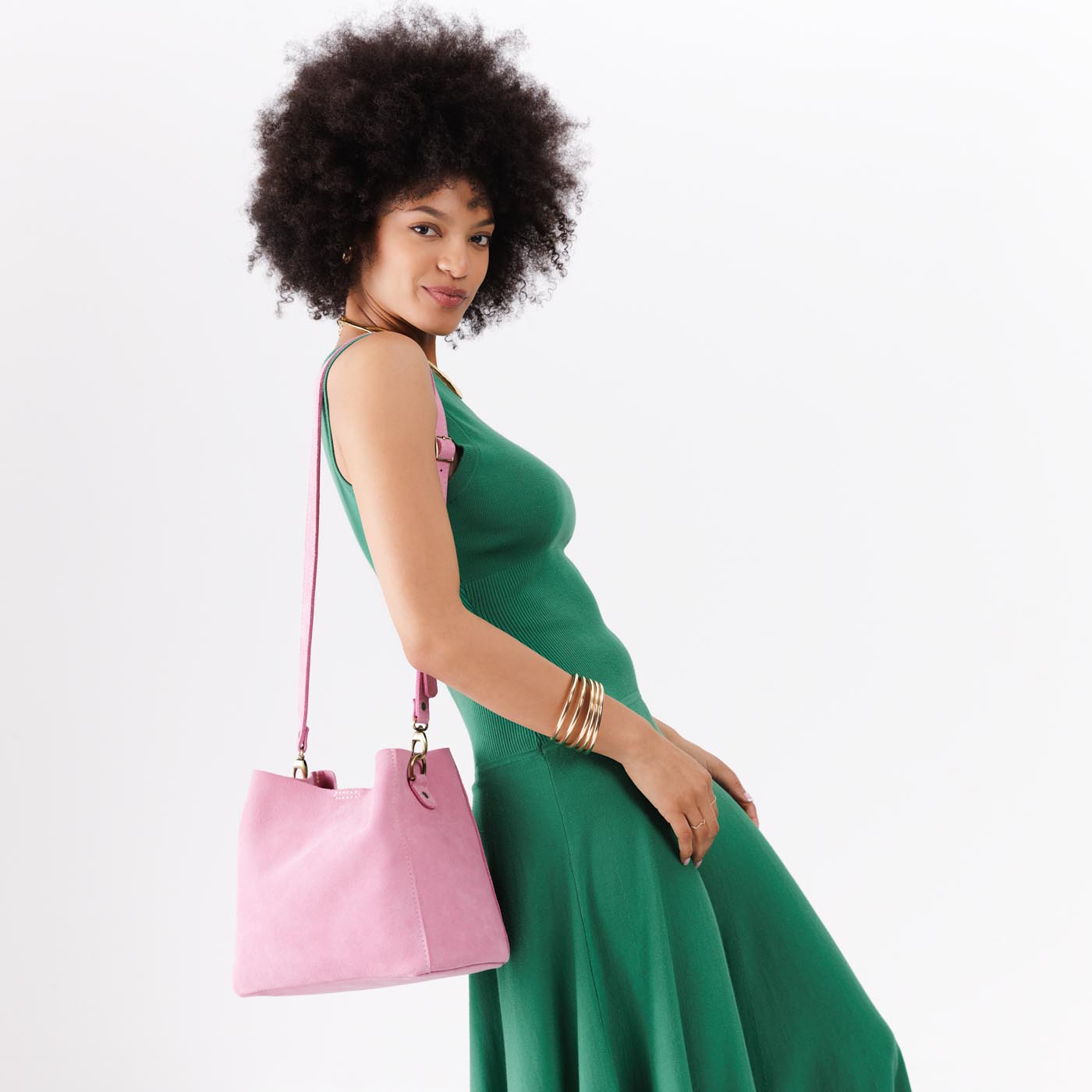 Pink Suede | symmetrical bucket bag with latch closure and removable crossbody strap