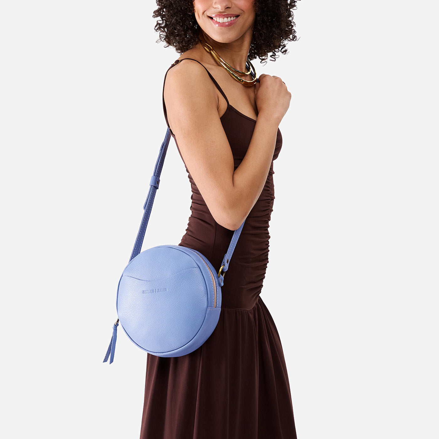 Aster*Large | Model wearing circle shaped crossbody bag with top zipper