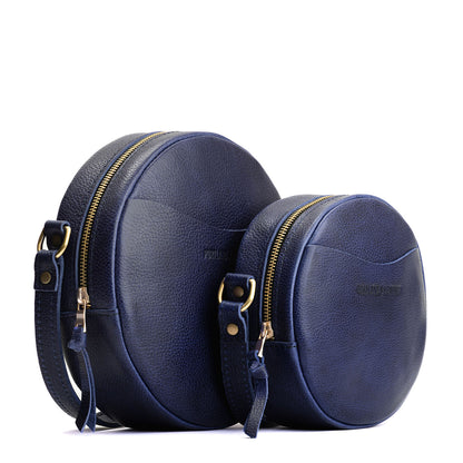 Cobalt | Size comparison image of small and large circle shaped crossbody bags with top zipper