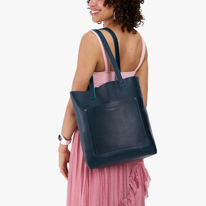 Boreal*Classic | Model holding medium Tote with dual shoulder straps and crossbody strap