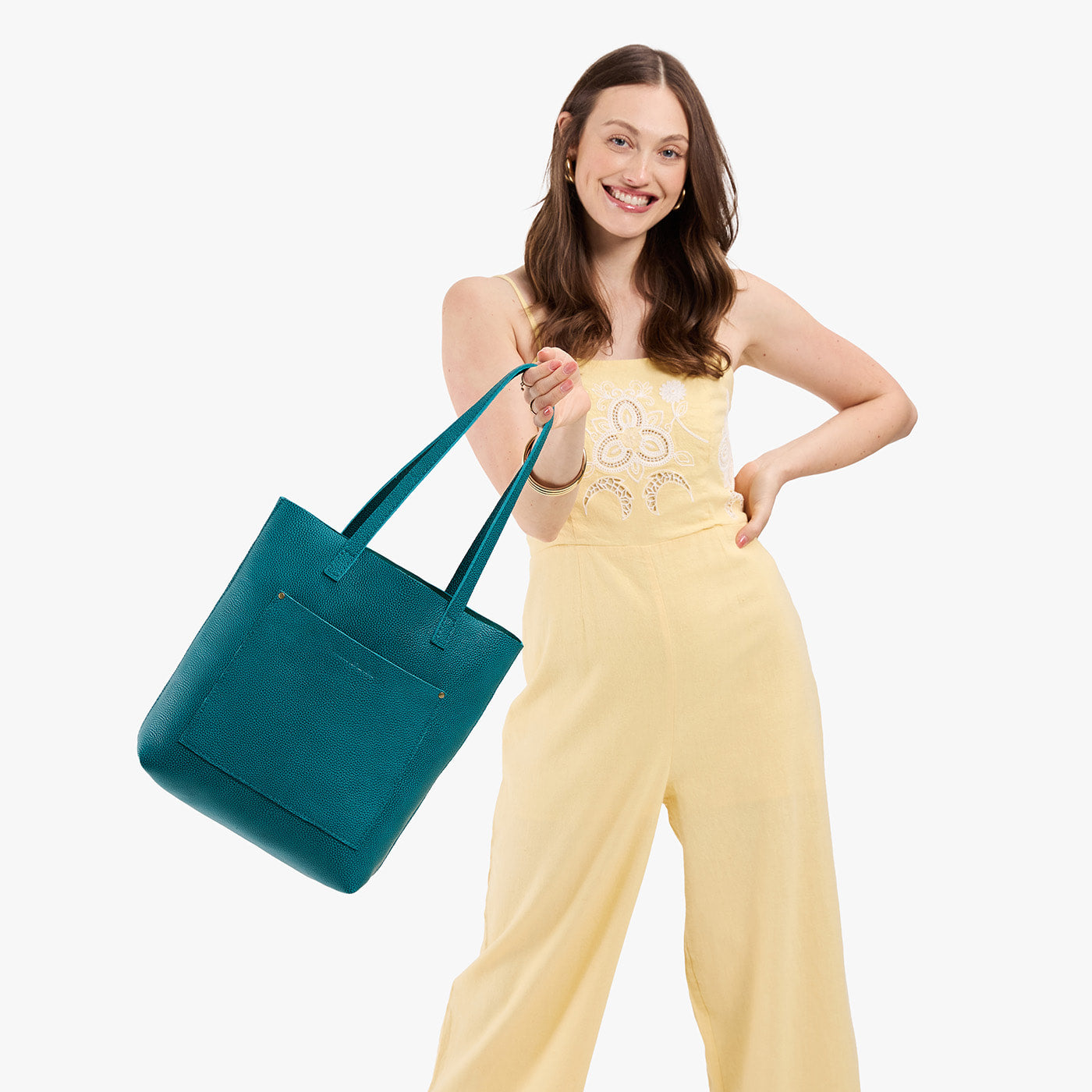 Aquarius*Classic | Model holding medium Tote with dual shoulder straps and crossbody strap