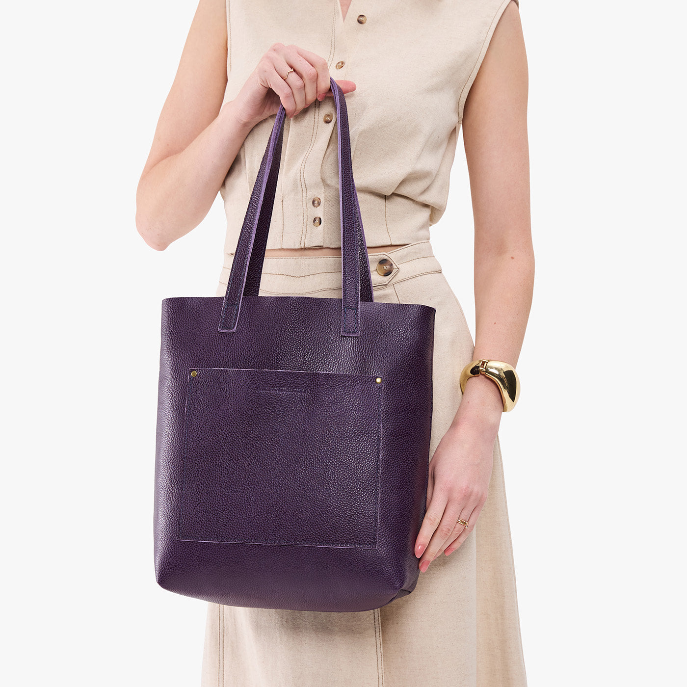 Empire*Classic | Model holding medium Tote with dual shoulder straps and crossbody strap