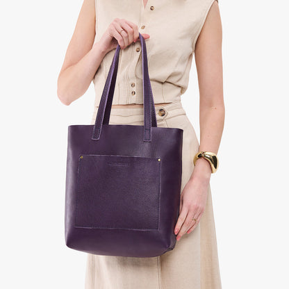 Empire*Classic | Model holding medium Tote with dual shoulder straps and crossbody strap
