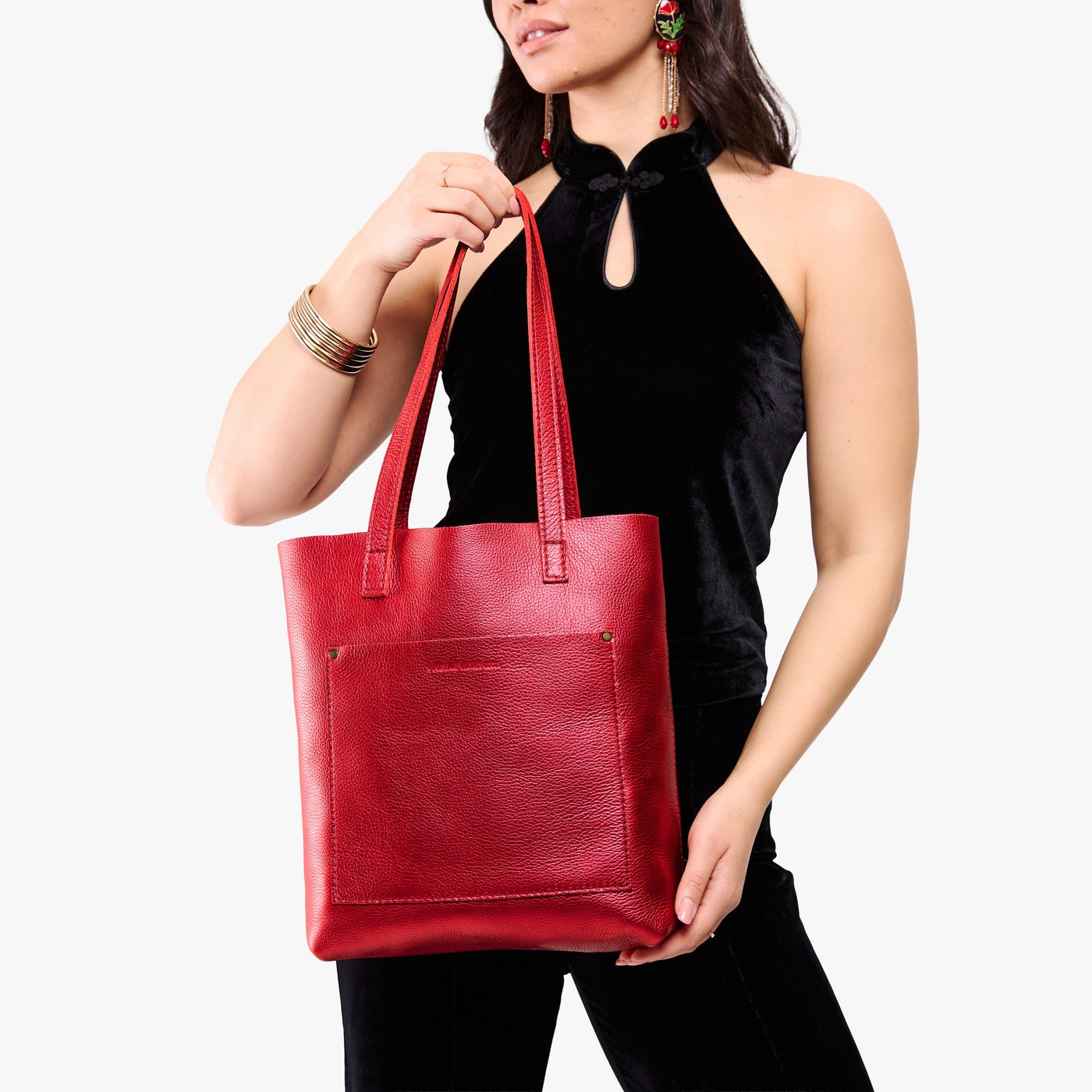 Reba Red*Classic | Model holding medium Tote with dual shoulder straps and crossbody strap