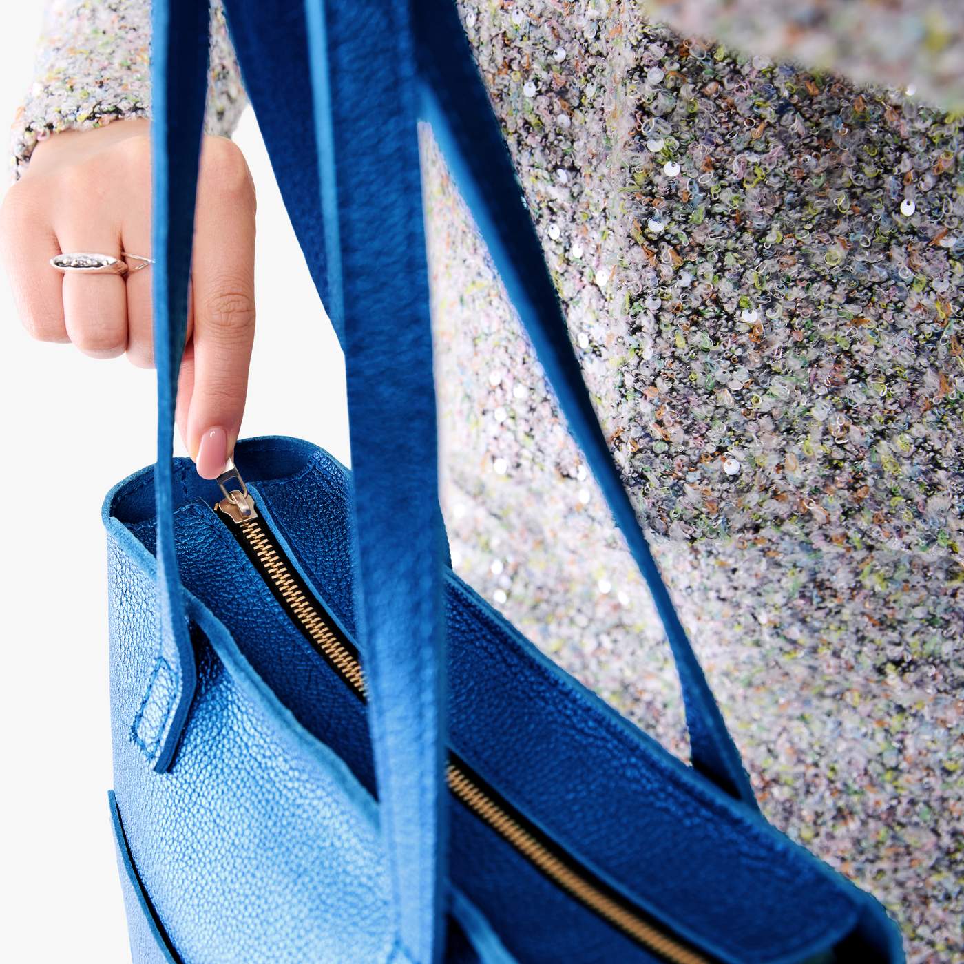Comet Blue*Zipper | Model holding medium Tote with dual shoulder straps and crossbody strap