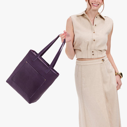 Empire*Zipper | Model holding medium Tote with dual shoulder straps and crossbody strap