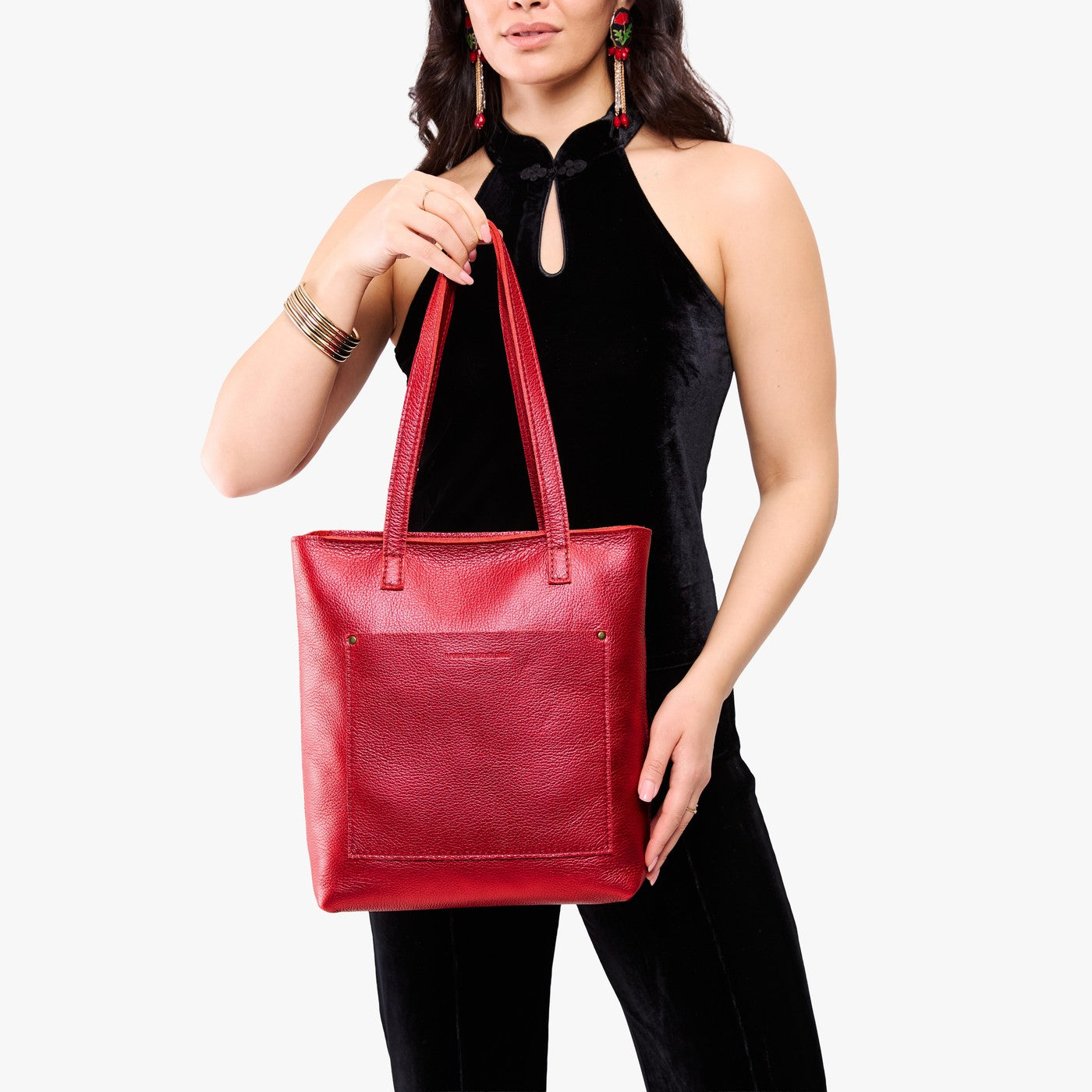 Reba Red*Zipper | Model holding medium Tote with dual shoulder straps and crossbody strap