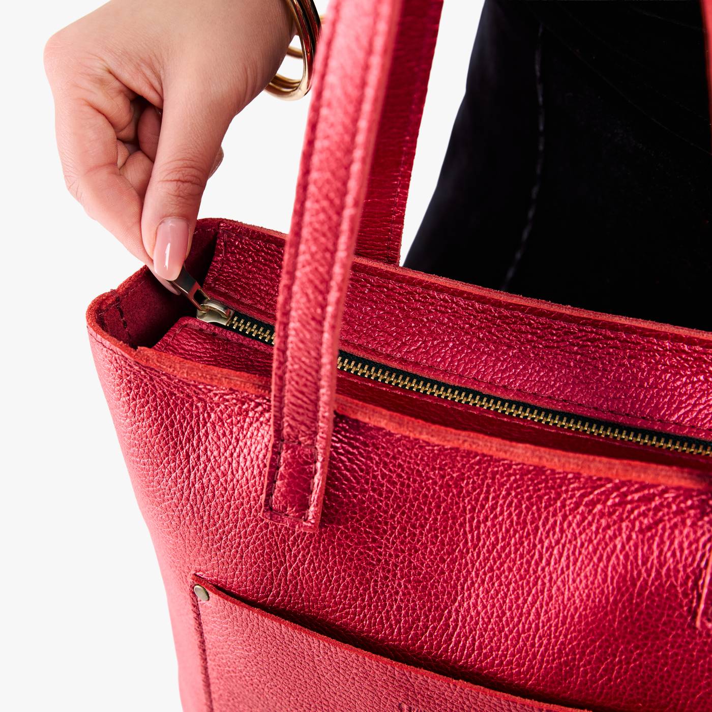 Reba Red*Zipper | Model holding medium Tote with dual shoulder straps and crossbody strap