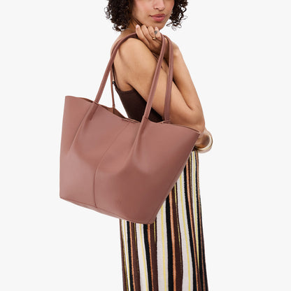 Sunkissed*Oversized | Model carrying extra wide bucket shaped tote bag with matching leather handles