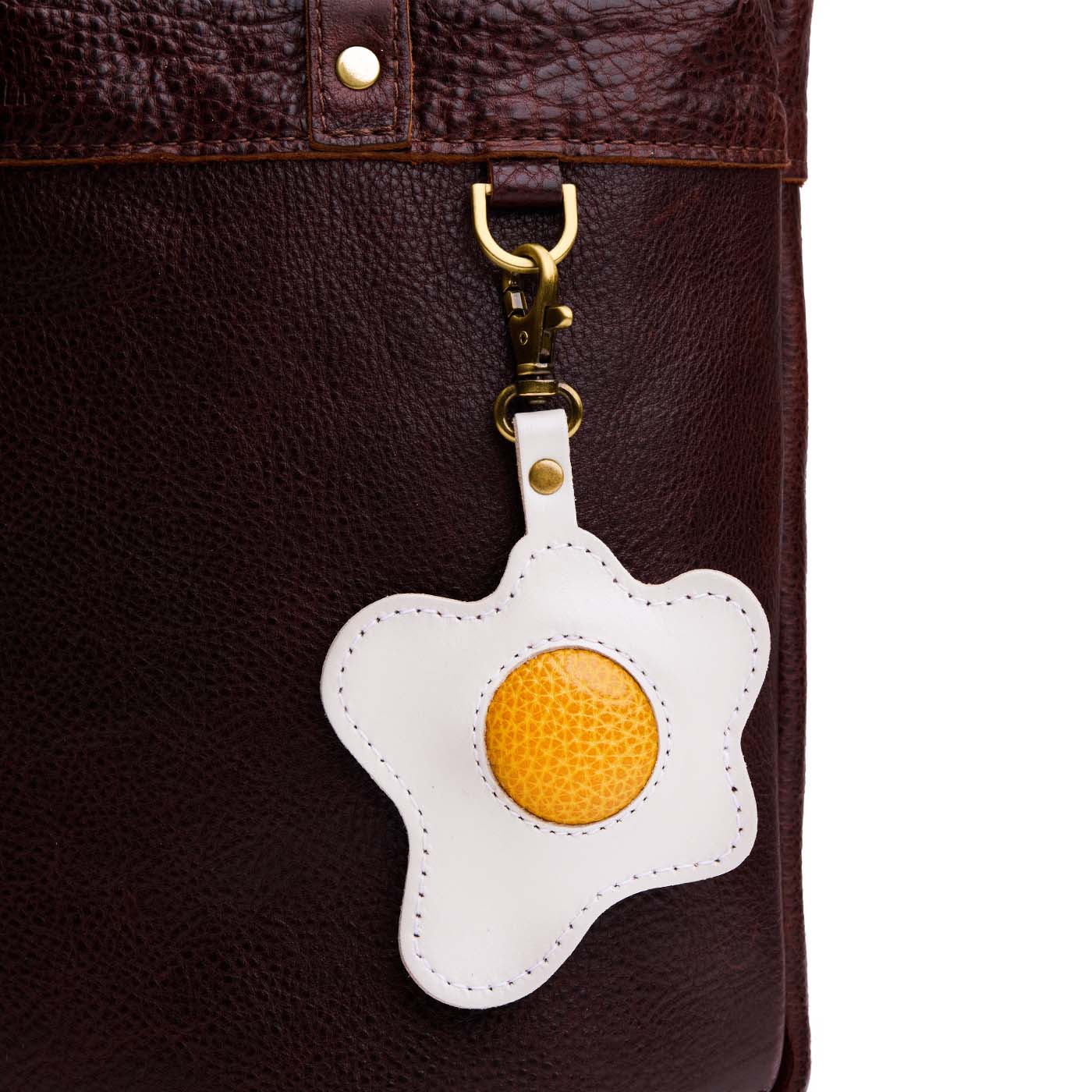 Egg | Keychain shaped like a fried egg with a swivel lobster clasp on a bag