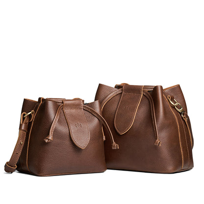 Asheville | Small and large symmetrical leather bags with leather drawstring closure and adjustable shoulder strap