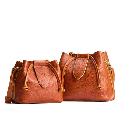 Sienna | Small and large symmetrical leather bags with leather drawstring closure and adjustable shoulder strap