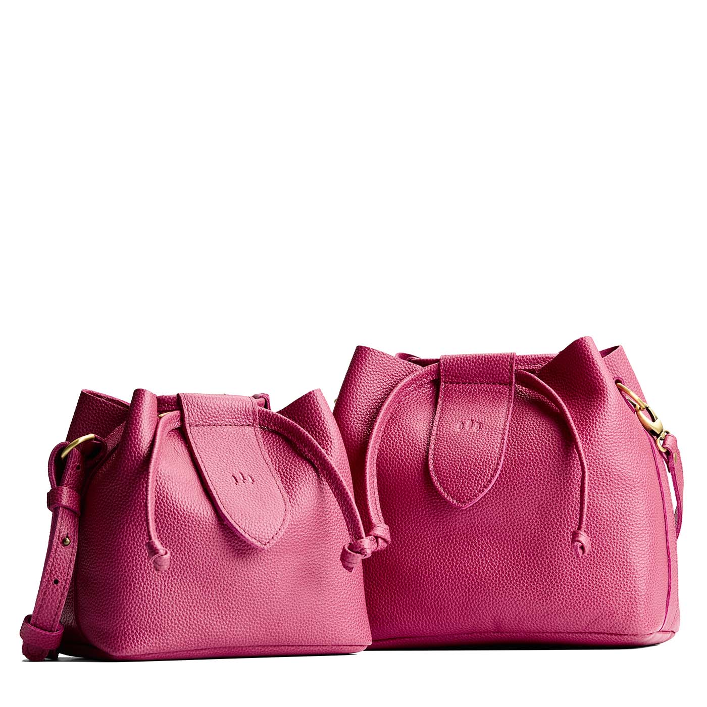 Wild Rose | Small and large symmetrical leather bags with leather drawstring closure and adjustable shoulder strap