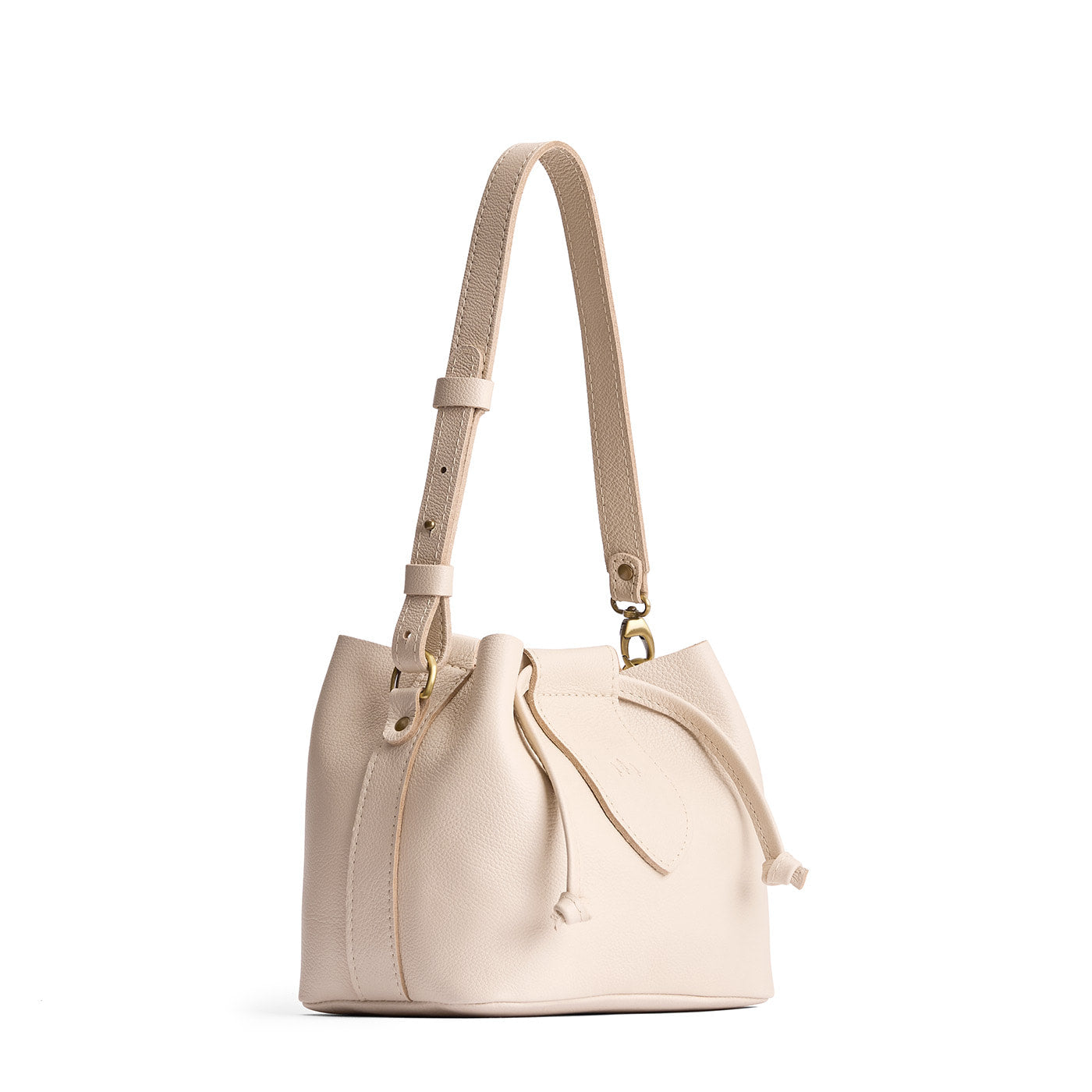 Pebbled Bone*Small | Symmetrical leather bag with leather drawstring closure and adjustable shoulder strap
