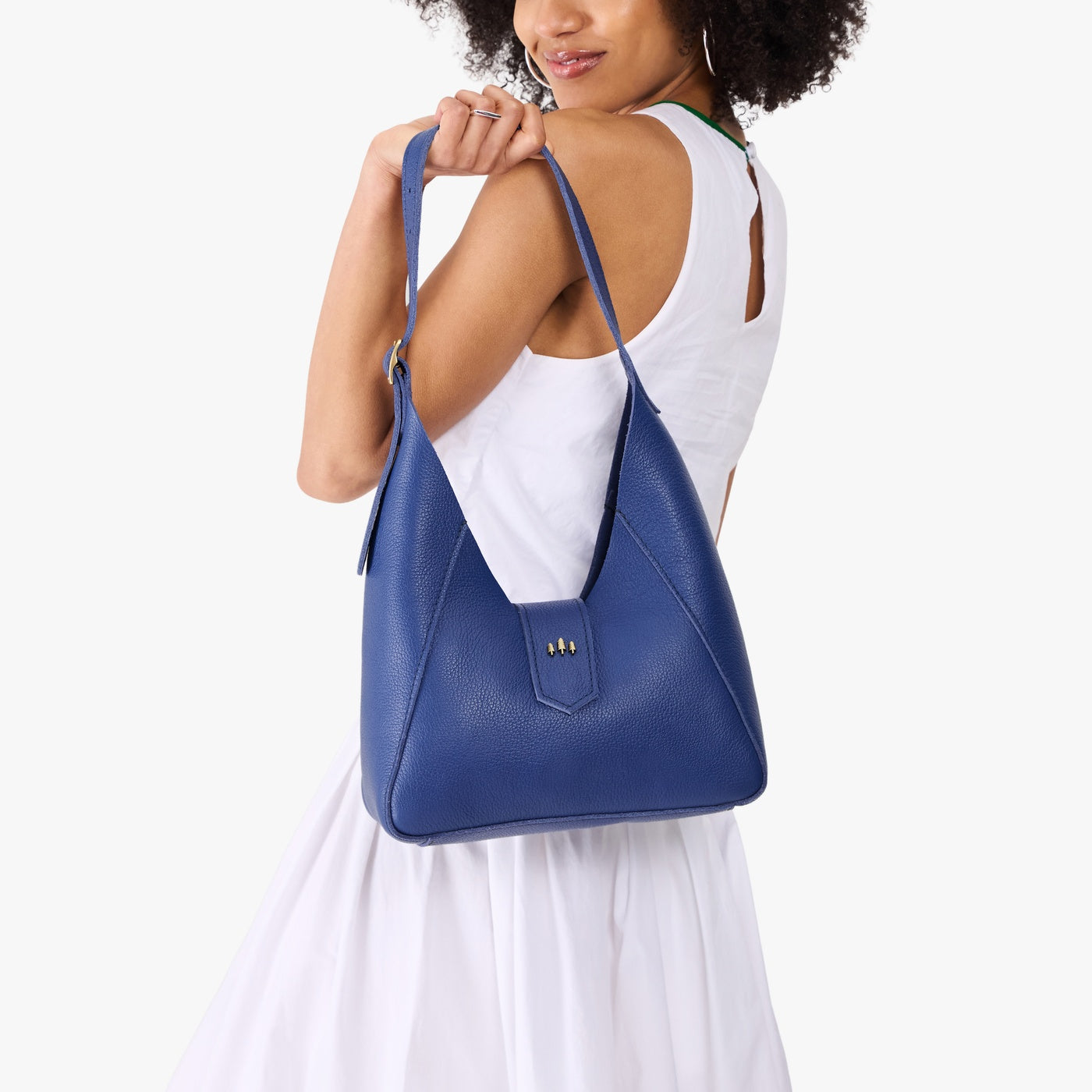 Molino Blue | Model wearing structured hobo shoulder bag with adjustable strap and magnetic closure