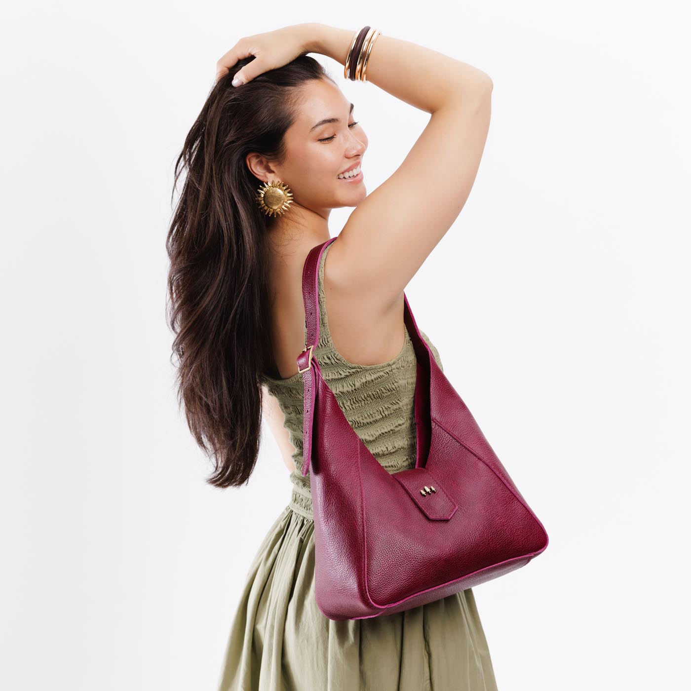 Orchid | Model wearing structured hobo shoulder bag with adjustable strap and magnetic closure