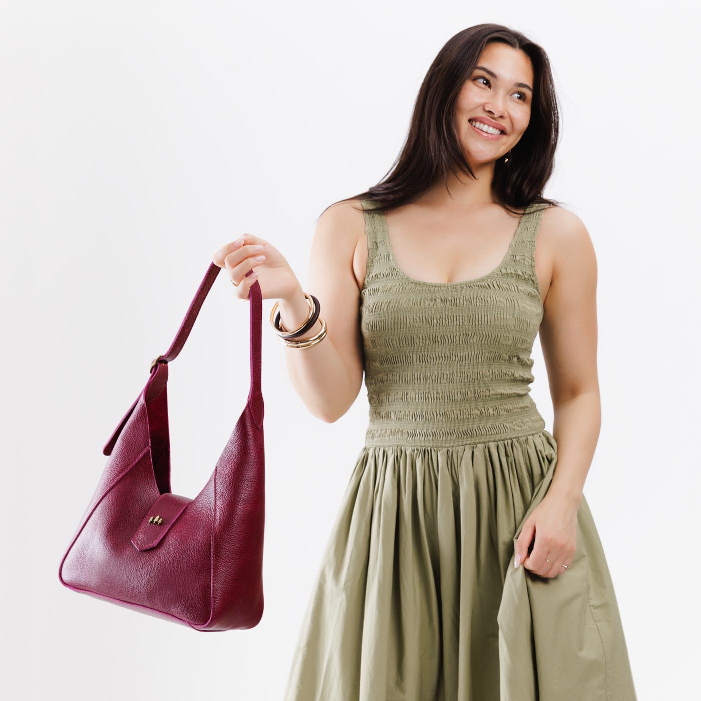 Orchid | Model wearing structured hobo shoulder bag with adjustable strap and magnetic closure