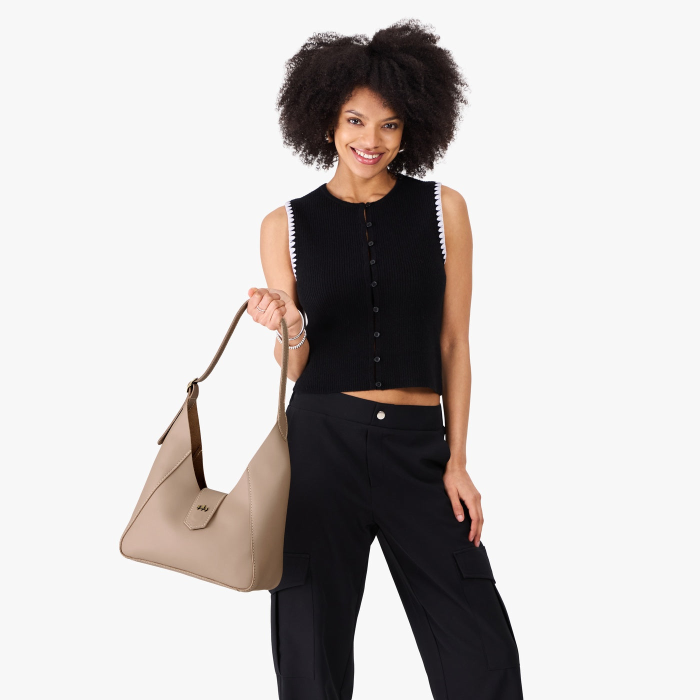 Stone | Model wearing structured hobo shoulder bag with adjustable strap and magnetic closure