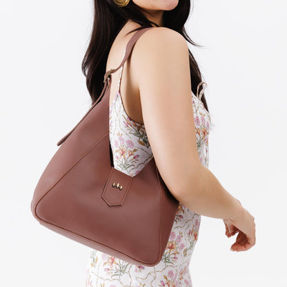 Sunkissed | Model wearing structured hobo shoulder bag with adjustable strap and magnetic closure