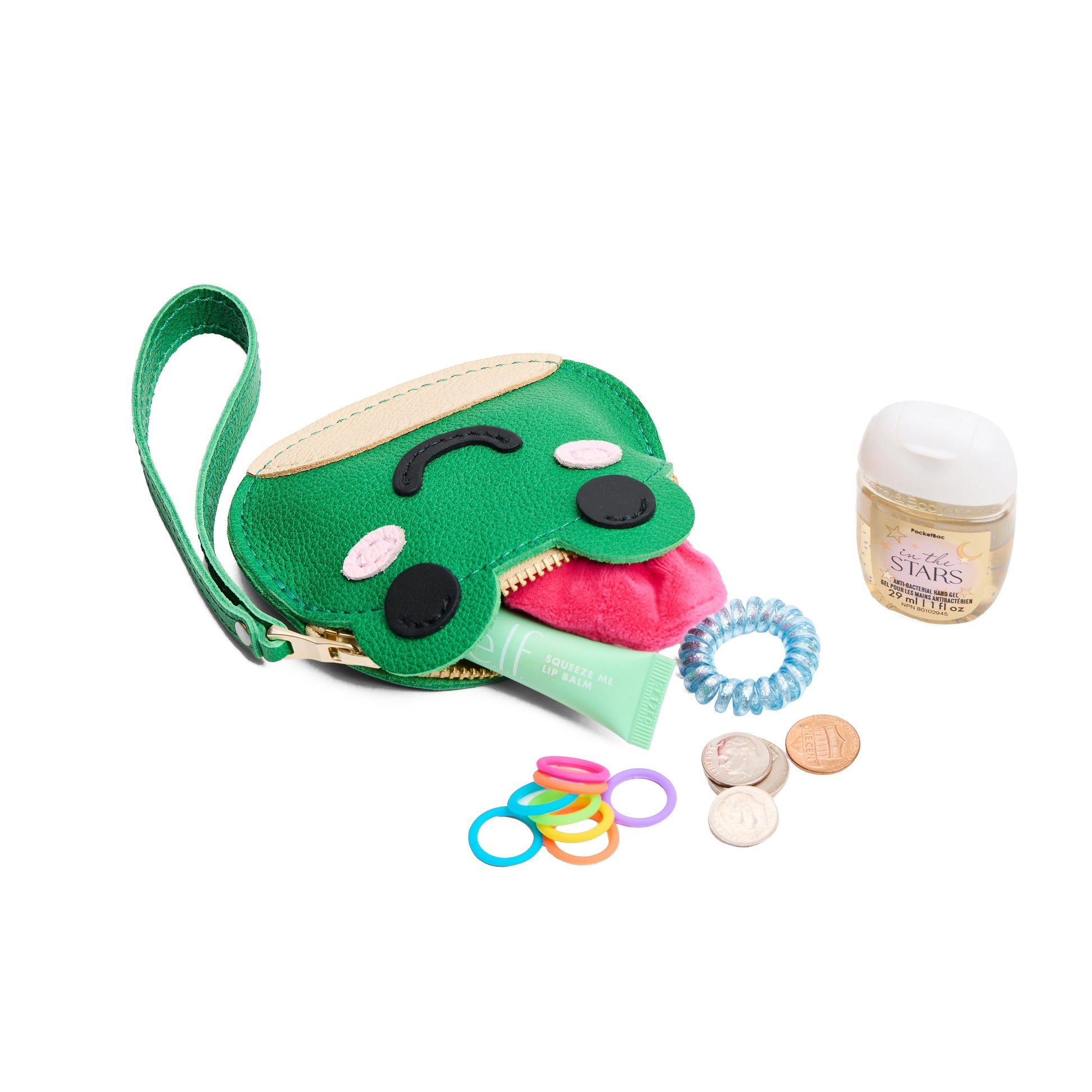 Jolly Green | Frog-shaped pouch with zipper opening, wristlet and products displayed