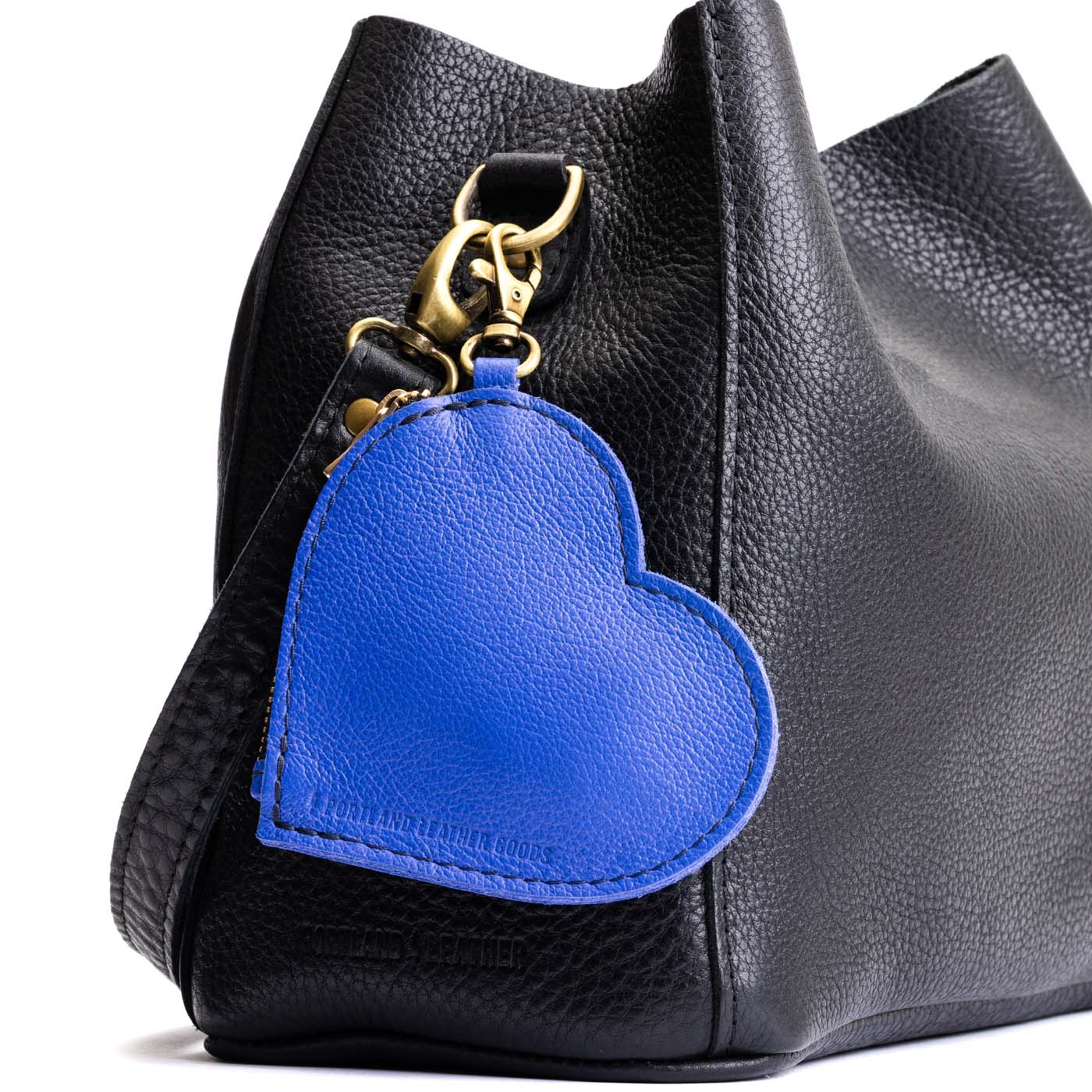 Astro Blue | Heart-shaped leather pouch keychain with zipper top and lobster clasp