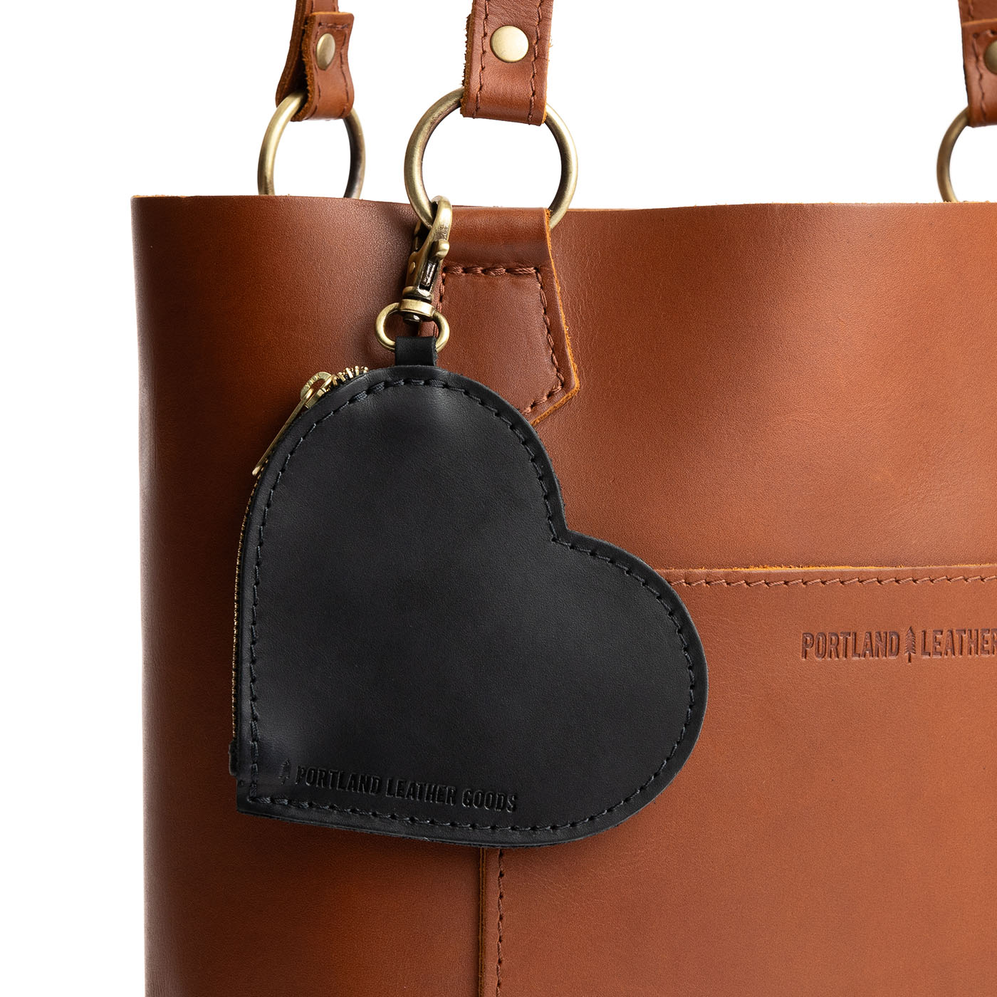Black | Heart-shaped leather pouch keychain with zipper top and lobster clasp