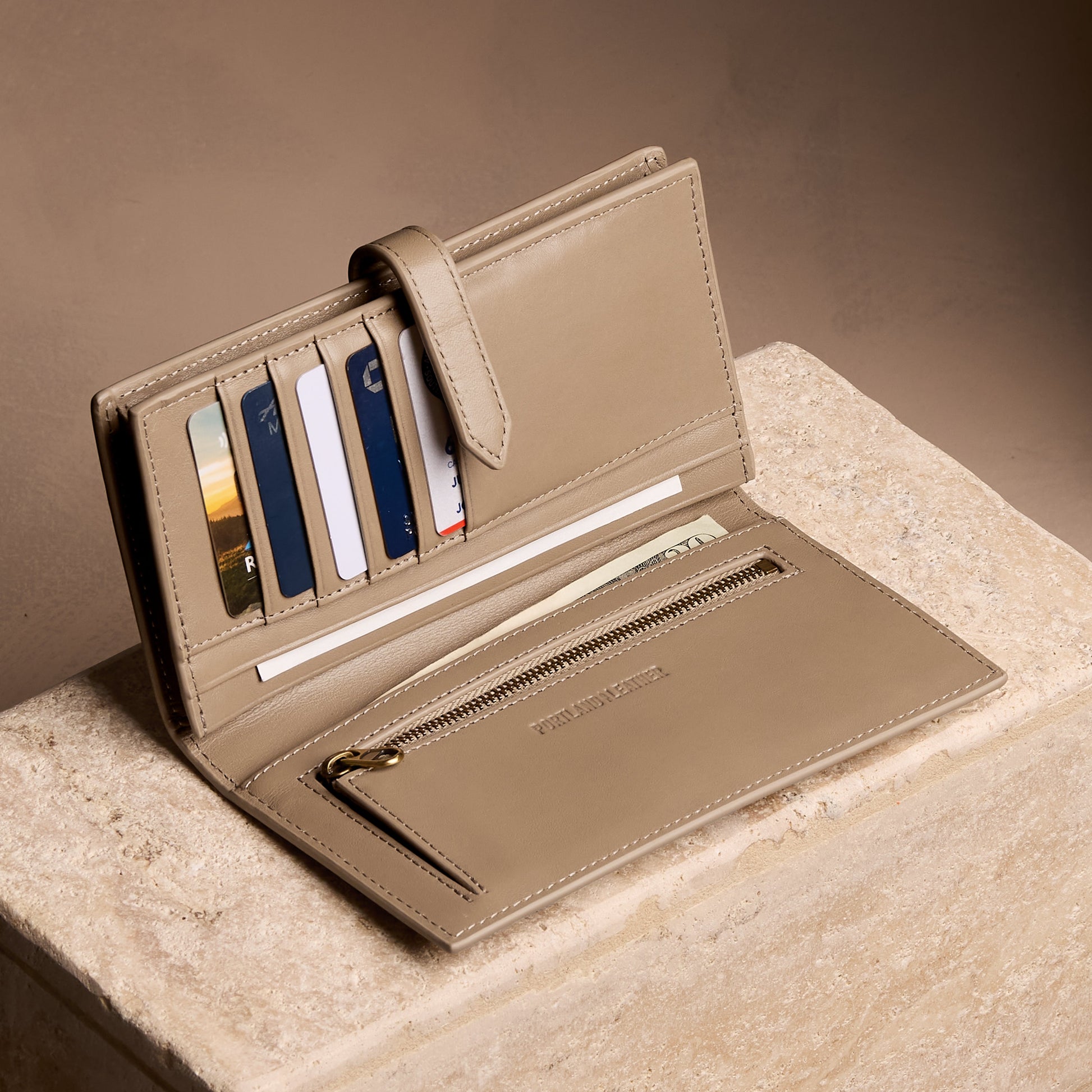 Satine*Large | Leather bifold wallet with a strap and bar closure