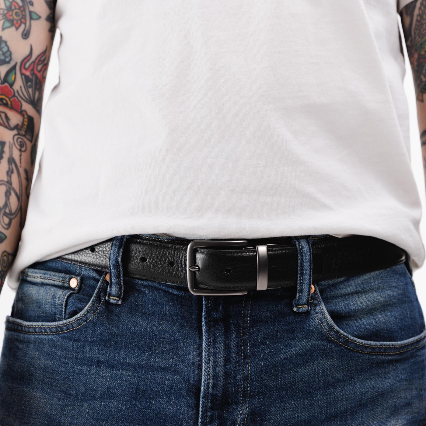 All Variants | A person wearing the Italian Reversable Leather Belt on the pebbled black side