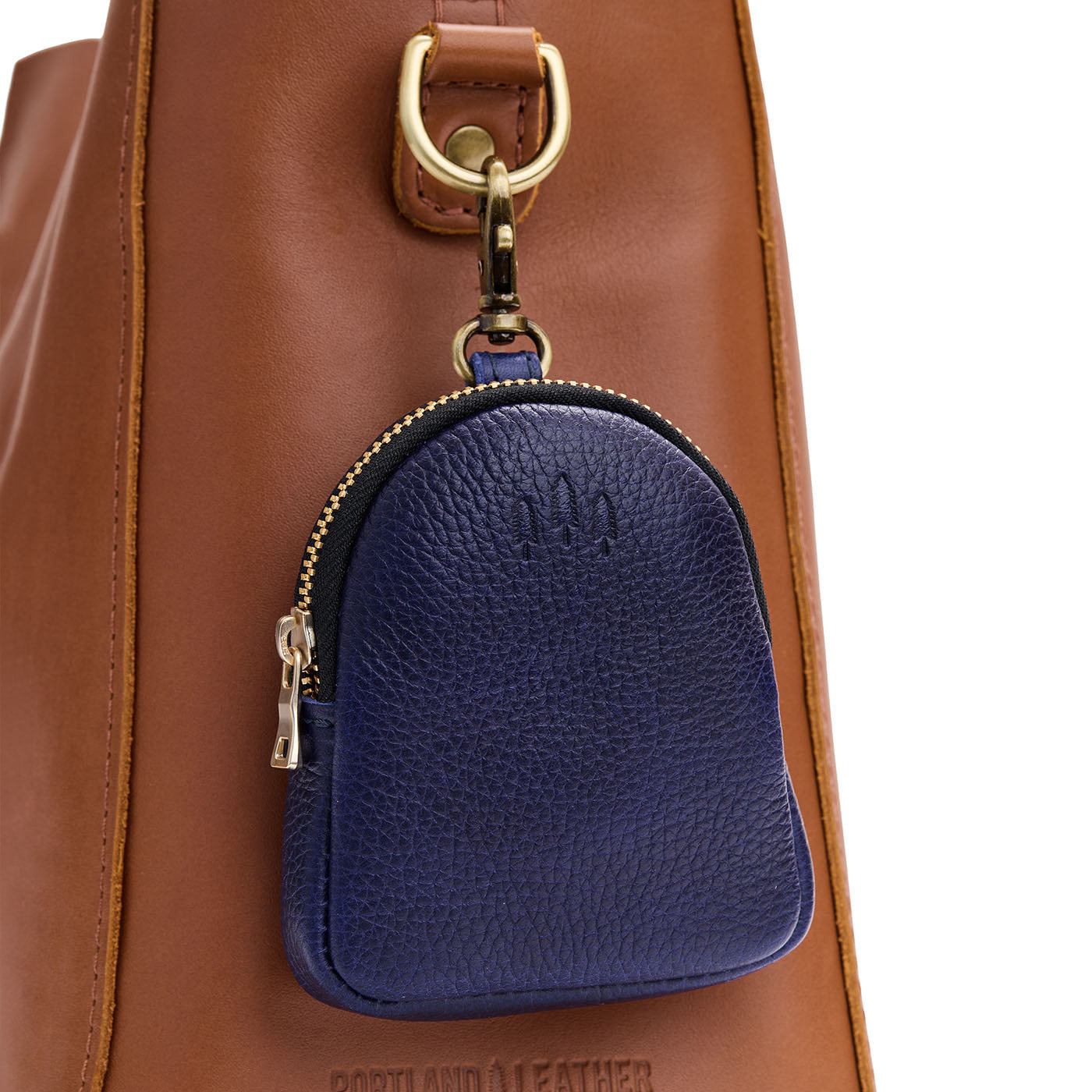 Cobalt | Leather keychain pouch with zipper top, swivel lobster clasp, and debossed emblem of three PLG trees