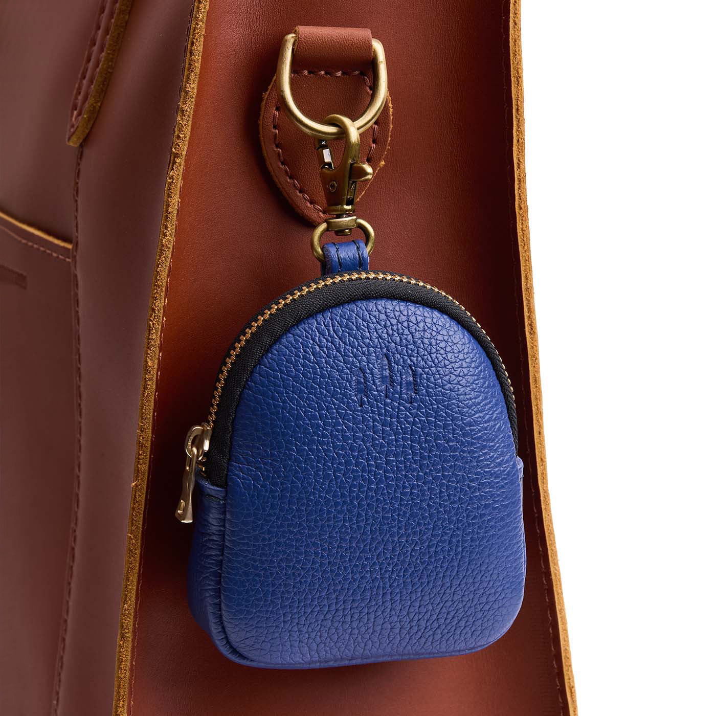 Molino Blue | Leather keychain pouch with zipper top, swivel lobster clasp, and debossed emblem of three PLG trees