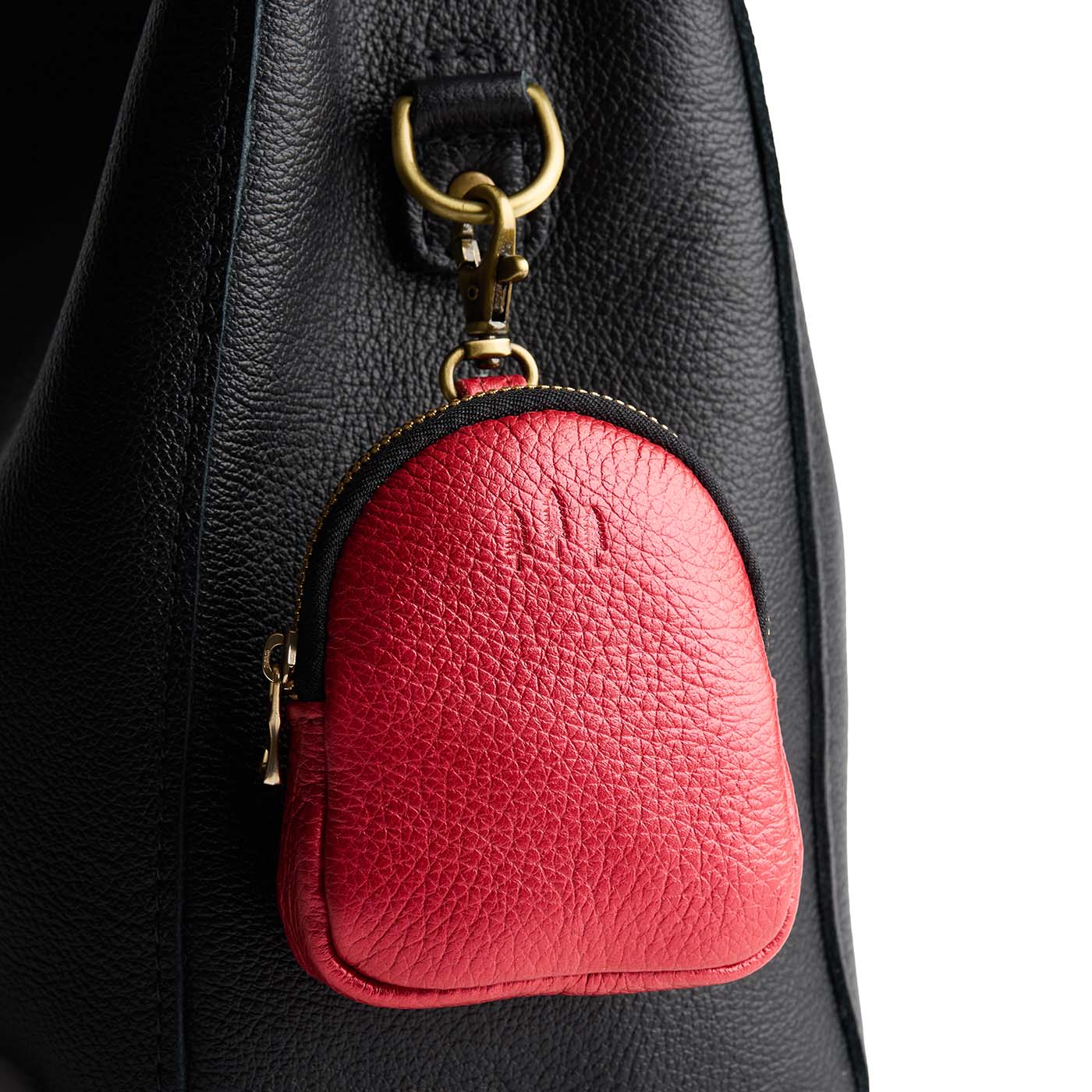 Reba Red | Leather keychain pouch with zipper top, swivel lobster clasp, and debossed emblem of three PLG trees