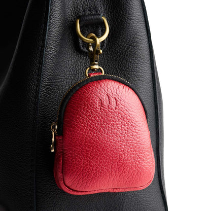 Reba Red | Leather keychain pouch with zipper top, swivel lobster clasp, and debossed emblem of three PLG trees