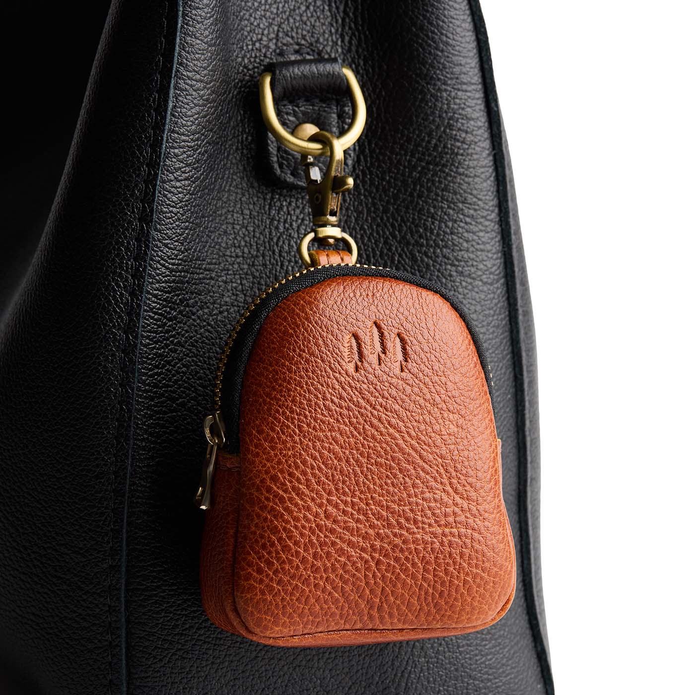 Sienna | Leather keychain pouch with zipper top, swivel lobster clasp, and debossed emblem of three PLG trees