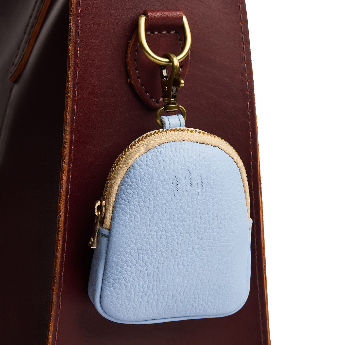 Skyway | Leather keychain pouch with zipper top, swivel lobster clasp, and debossed emblem of three PLG trees