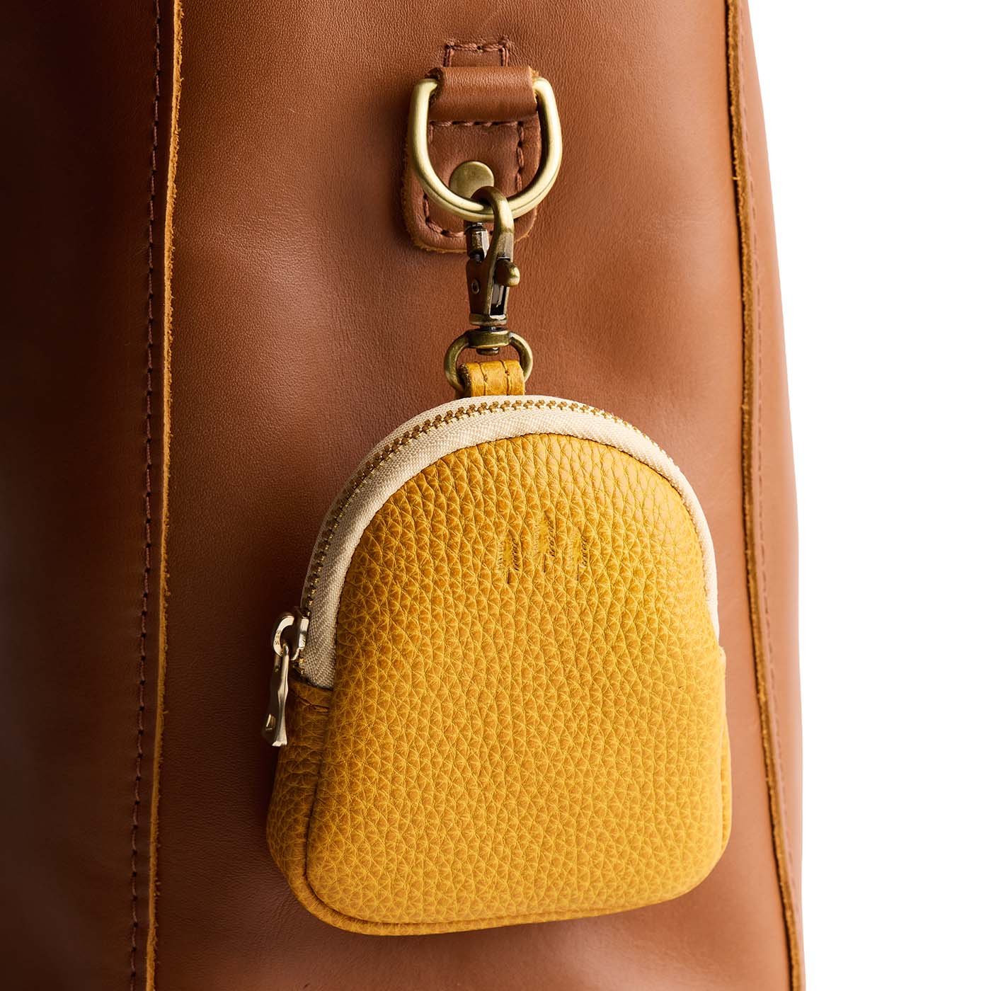 Sunshine | Leather keychain pouch with zipper top, swivel lobster clasp, and debossed emblem of three PLG trees