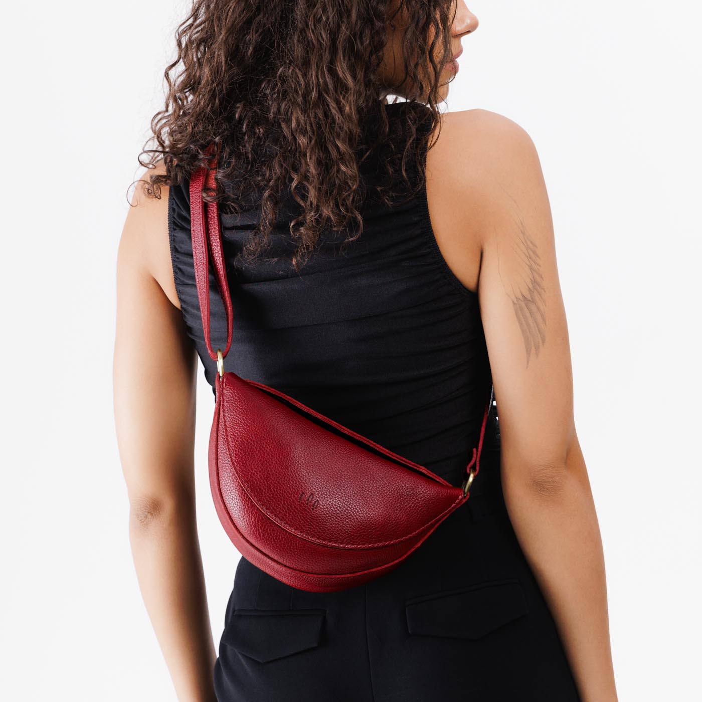 Chili Red*Small | Model wearing petite half circle shaped sling bag