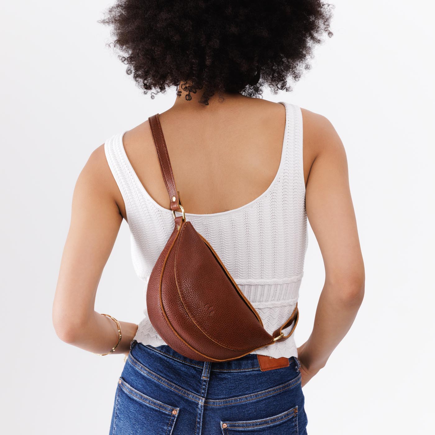 Nutmeg*Small | Model wearing petite half circle shaped sling bag