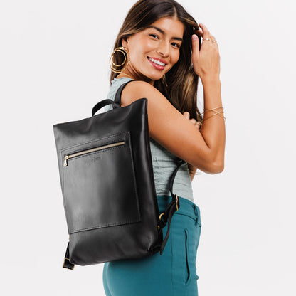 All Color: Black | Model wearing rectangular slim leather laptop backpack VARIANT2