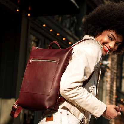 All Color: Cognac | Model wearing rectangular slim leather laptop backpack